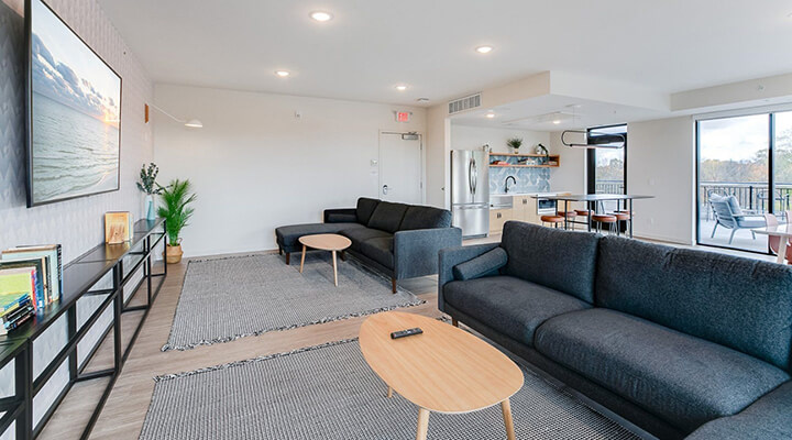 the community room lounging area with a large tv