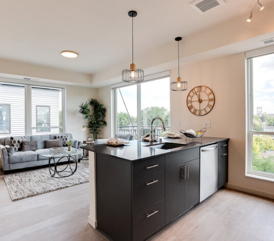 an apartment kitchen and living room