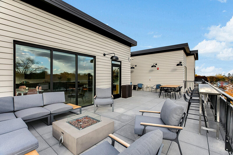 the community balcony with seating and a firepit