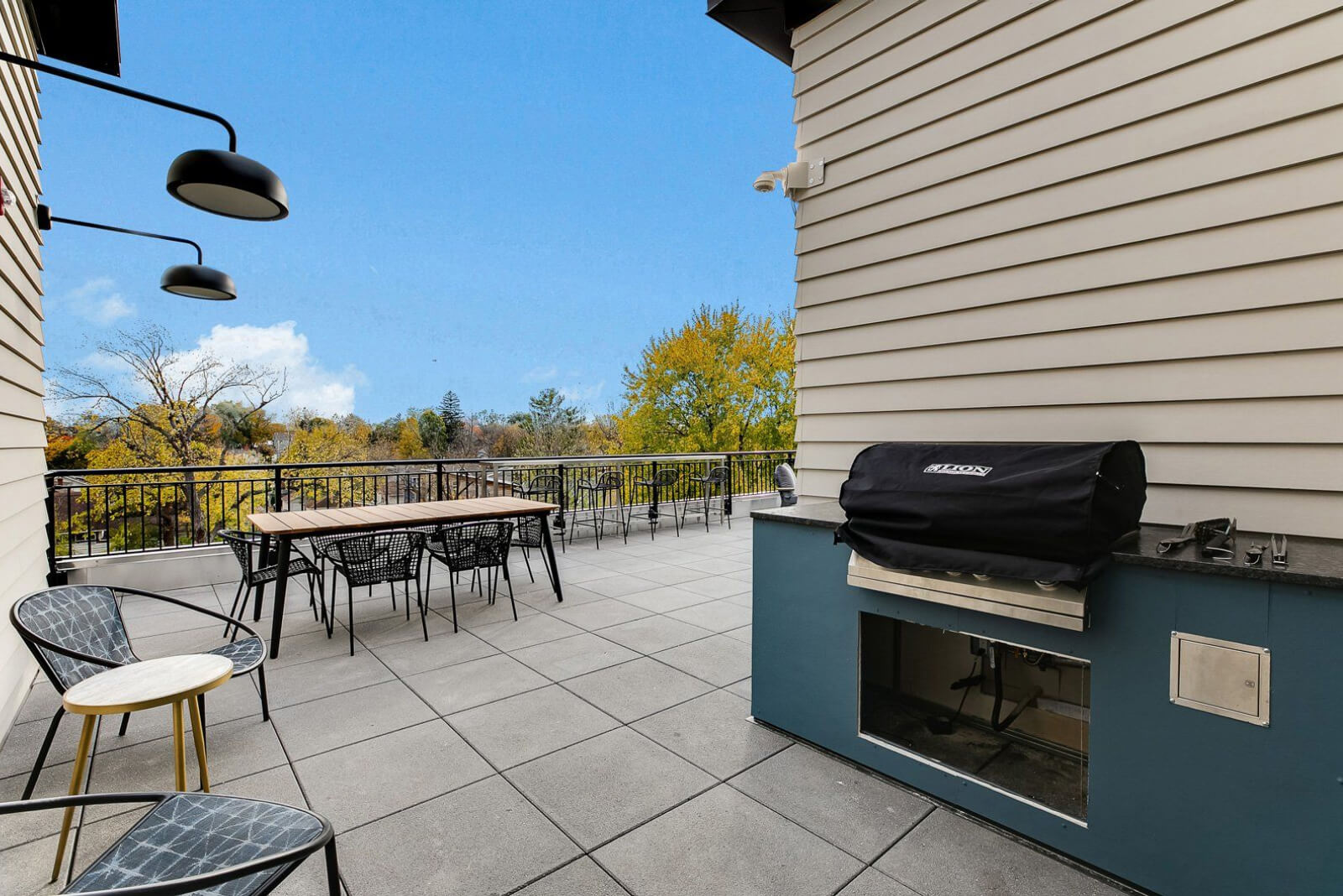 the community balcony with a grill and seating